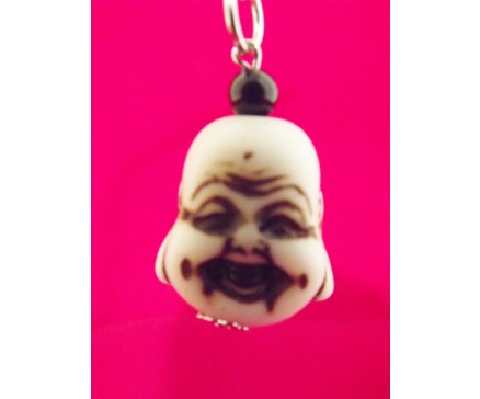 7102034 Sleutelhanger hoofd boeddha lucky 2,5 cm. Per 12 stuks verpakt. Prijs is per 12 stuks.