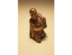 BR00011 Brons. Mini bronzen traveller lucky buddha zilverkleurig +/- 4 cm.