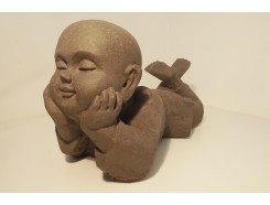 G1419S-G Garden. Liggende kindmonnik in gedachten verzonken. L x H : 37 x 20 cm. Granite.